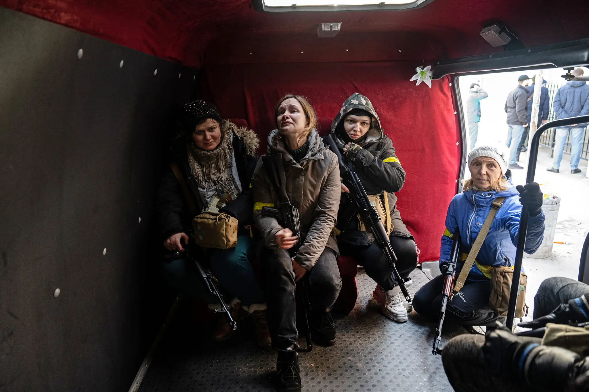 A teacher and Territorial Defense Forces volunteer, Julia, crying before deployment. Retrieved from the New York Times.