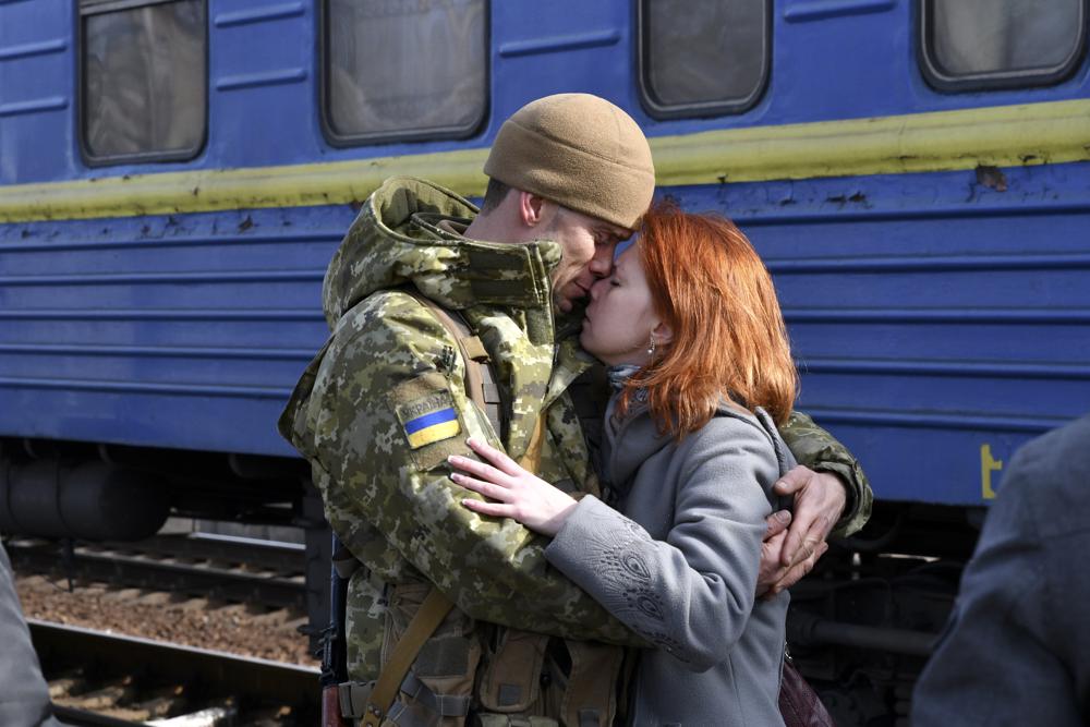 A Ukrainian couple embracing for one last time at a train station in Kramatorsk, eastern Ukraine. Retrieved from the Associated Press.